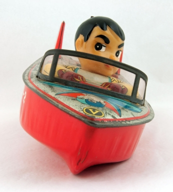 Japanese Boy Driving Motorboat
