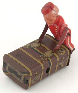 Boy Porter Pushing Trunk