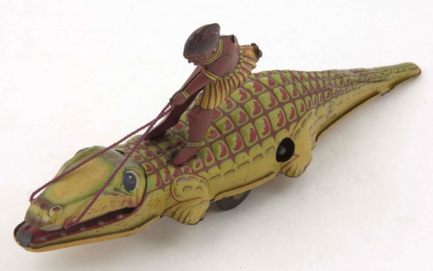 African Man Riding a Crocodile