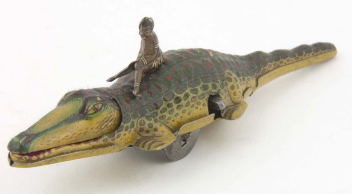 African Man Riding a Crocodile
