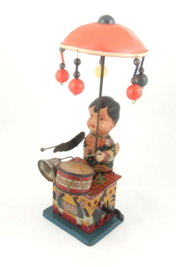 Boy Playing Bell and Drum