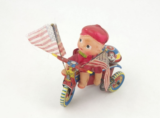"Boy on Bike with Flags"