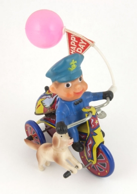 Policeman on Tricycle with Dog