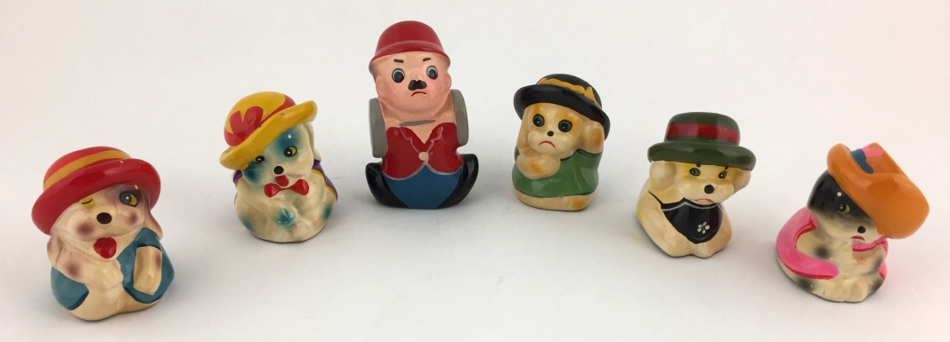 "Charlie Chaplin and his Five Hatted Dogs"